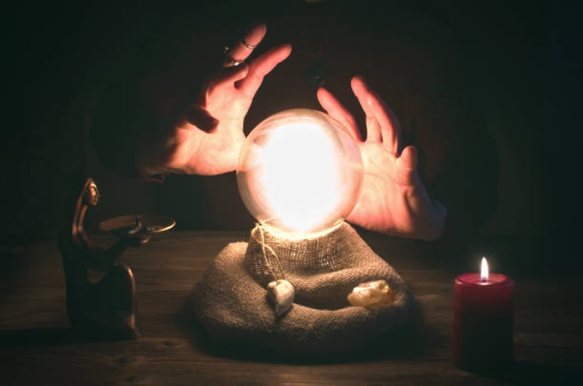 Crystal ball and fortune teller hands. Divination concept. The spiritual seance. Future reading.